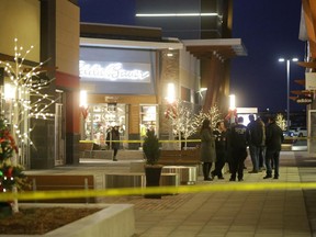 Police tape outside Polo Ralph Lauren store as police investigate a Boxing Day shooting at the Tanger Outlets off Huntmar Rd. in Kanata (Ottawa) this afternoon, Friday, December 26, 2014. One person suffered minor injuries. Ottawa police are investigating. Mike Carroccetto / Ottawa Citizen