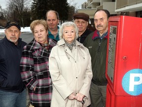 Residents of Montfort Manor from left: Andy Charette, Michele Girard, Stephen Maclellan, Fernande Louis-Seize, Louis Bourre and Chuck Bergeron are upset about their old visitor's parking spots being converted to pay-parking spots.