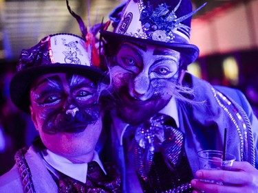 Roger, left, and Daniel Rivera attend The Mad Hatter's New Year's Ball at the Ernst & Young Centre on Wednesday, Dec. 31, 2014.