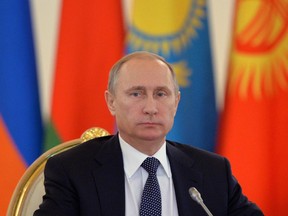 Russian President Vladimir Putin attends a meeting of the CSTO (Collective Security Treaty Organization) at the Kremlin in Moscow on December 23, 2014.