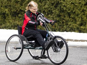 Ruth Hurst pedals her hand bike in Kanata Wednesday Dec. 24, 2014.