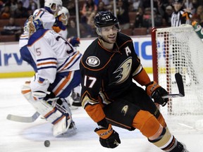 Anaheim Ducks' Ryan Kesler celebrates after scoring against Edmonton Oilers goalie Viktor Fasth, background left, of Sweden, during the second period of an NHL hockey game Wednesday, Dec. 10, 2014, in Anaheim, Calif.