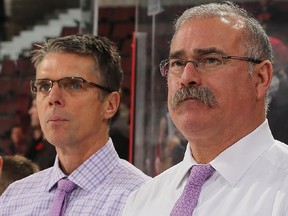 Dave Cameron and Paul MacLean on the bench together.