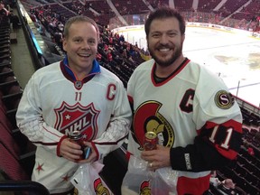 Scott Leduc, left, came from Oakville to watch Thursday night's game with friend Daniel Tremblay.