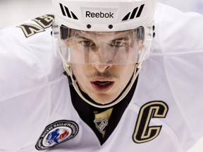 Pittsburgh Penguins' Sidney Crosby lines up for a face off during NHL hockey action against the Toronto Maple Leafs in Toronto on November 14, 2014. Crosby has the mumps.The Penguins confirmed the news Sunday morning after the captain sat out two games for precautionary reasons.