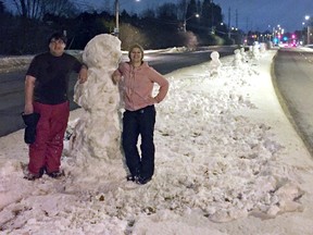 Zachery and Rochelle Fortier sculpt the Baseline snow people each year. This time they had some help from their dad, Rock.
