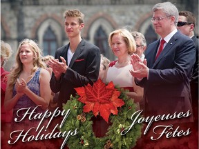 Canadian Prime Minister Stephen Harper is pictured with his wife Laureen Harper and their children Ben and Rachel during Canada Day celebrations on the cover of the prime minister's 2014 Christmas card.