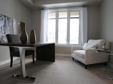 A main-floor study in the Kawartha can be a potential fifth bedroom with an upgrade, as is done in the model, that turns an adjacent powder room into a full bathroom linked to the study by a cheater door (not shown).