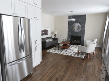 The kitchen opens to the living room in the Lakefield, which doubles as the sales centre.