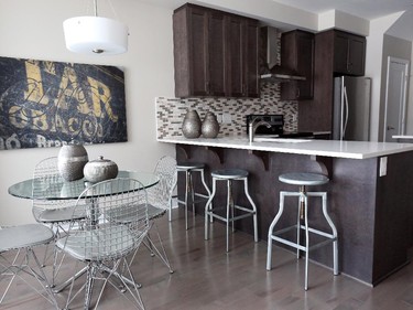 The galley kitchen and breakfast nook in the Quartz townhome are separated from the living room and dining room.