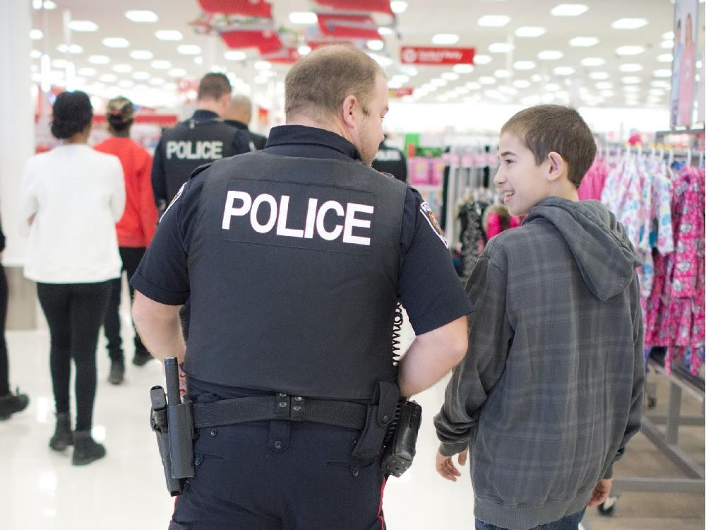 Police help kids with Christmas shopping (with video) | Ottawa Citizen