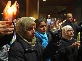 The Pakistan High Commission held a candle light vigil to mourn the innocent victims of a terrorist attack in Peshawar and to show solidarity with their families at the Ottawa City Hall, December 18, 2014.
