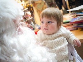 The United States Marines from the U.S. Embassy in Ottawa helped to brighten the holiday season for the children of Ronald McDonald House by bringing them gifts collected through their annual Toys for Tots campaign. Charlotte Henderson who will celebrate her first birthday on Friday wasn't so sure what to think of Santa Thursday December 18, 2014.