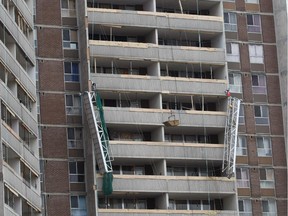 A platform hangs from the side of 2757 Kipling Ave. in Etobicoke after it broke on Dec. 24, 2009, causing the deaths of four people.