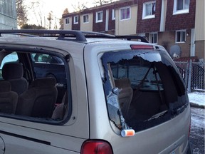 Vehicle parked in a lot behind the 2200 block of Penny Drive, whose windows were shot out according to the police. (Pat McGrath/Ottawa Citizen) ORG XMIT: POS1412050745470455