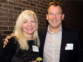 Y fitness instructor and personal trainer Kathy Godding with donor Chris Taggart, president of Tamarack Developments, at a YMCA-YWCA donor event held at the downtown Taggart Family Y on Tuesday, December 2, 2014.