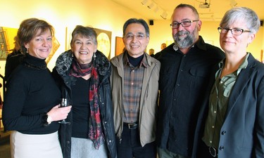 From left, Cube Gallery co-owner Becky Rynor with visual artists Paula Zoubek and Norman Takeuchi, co-owner and artist Don Monet, and visual artist MaryAnn Camps at the vernissage for the art gallery's 10th anniversary exhibition, held Sunday, January 11, 2015.