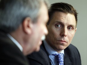 Provincial Tory leadership candidate, Patrick Brown, right, listens to Carleton-Mississippi Mills MPP, Jack MacLaren, in the Ottawa Citizen's national bureau in Ottawa Friday January 16, 2015. Brown was announcing his endorsement by MacLaren.