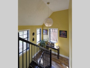 The addition of an open staircase with solid hardwood treads adds to the spacious feel.
