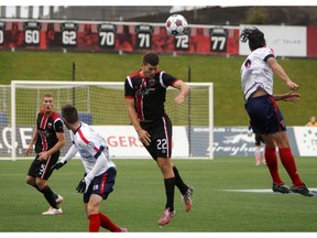 Ottawa Fury's Ryan Richter goes up for a header during NASL gameplay against the Indy Eleven at TD Place on Sunday, October 26, 2014. (Cole Burston/Ottawa Citizen)
