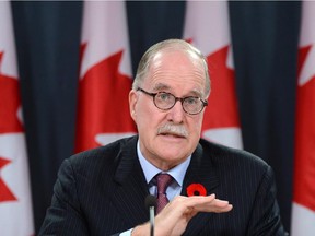 Commissioner of Official Languages Graham Fraser holds a press conference at the National Press Theatre in Ottawa on Thursday, November 7, 2013, regarding the release of his 2012-2013 Annual Report. THE CANADIAN PRESS/Sean Kilpatrick ORG XMIT: OTTK101