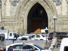RCMP and Ottawa Police are searching for potential of other shooters after a shooter was reported to be shot dead Oct 22 by security at Parliament Hill. A soldier at the War Memorial Cenotaph was shot just moments before. The soldiers condition is unknown at this time. (Pat McGrath / Ottawa Citizen)