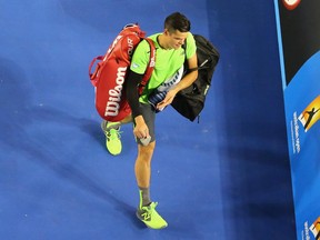 Milos Raonic of Canada leaves the court after losing his quarter final match against Novak Djokovic of Serbia during day 10 of the 2015 Australian Open at Melbourne Park on January 28, 2015 in Melbourne, Australia.