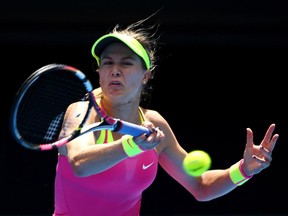 Eugenie Bouchard plays a forehand in her fourth round match against Irina-Camelia Begu of Romania during day seven of the 2015 Australian Open at Melbourne Park on January 25, 2015 in Melbourne, Australia.