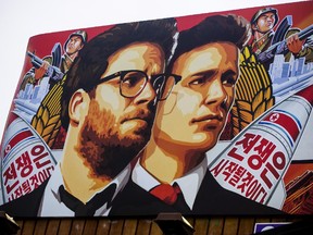 A banner for "The Interview"is posted outside Arclight Cinemas, Wednesday, Dec. 17, 2014, in the Hollywood section of Los Angeles. A U.S. official says North Korea perpetrated the unprecedented act of cyberwarfare against Sony Pictures that exposed tens of thousands of sensitive documents and escalated to threats of terrorist attacks that ultimately drove the studio to cancel all release plans for "The Interview." (AP Photo/Damian Dovarganes)
