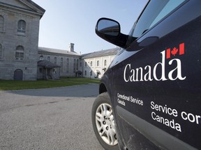 A Corrections Canada vehicle sits on inner side of the main gatehouse of Kingston Penitentiary in Kingston, Ont., in 2013. The penitentiary closed on Sept. 30, 2013, after 178 years of service.
