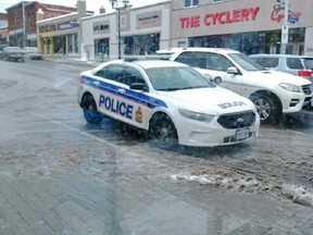 It's difficult to see because of the slush, but the cruiser is parked across the Hopewell Avenue right-turn lane.