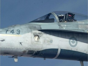 A Royal Canadian Air Force CF-18 Hornet is refueled by a KC-135 Stratotanker assigned to the 340th Expeditionary Air Refueling Squadron, Thursday, Â Oct. 30, 2014 over Iraq. THE CANADIAN PRESS/HO-U.S. Air Force Photo by Staff Sgt. Perry Aston