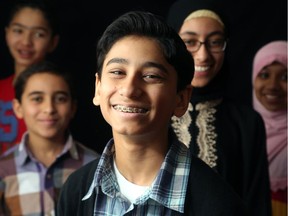 Aadam Sherazi, front, has memorized the entire Qur'an - in Arabic. He is 13 years old and is a Grade 8 student at The Muslim Association of Canada's Alfurqan School in Ottawa.