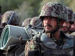 Afghan National Army soldiers attend a handover ceremony of NATO's International Security Assistance Force (ISAF) in Kandahar province on January 11, 2015.