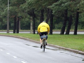 A lone biker travels along the West bound Ottawa River Parkway. A study recommends closing the west-bound lanes in order to transform them into a bicycle-only linear park.