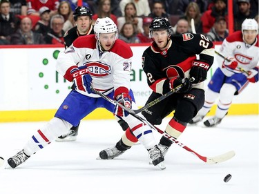 Alex Galchenyuk, left, battles for the puck with Erik Condra in the second period.