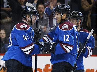 Colorado Avalanche right wing Jarome Iginla, center, celebrates his goal with left wing Alex Tanguay, left, and defenseman jan Hejda, of the Czech Republic, against the Ottawa Senators during the first period of an NHL hockey game Thursday, Jan. 8, 2015, in Denver.