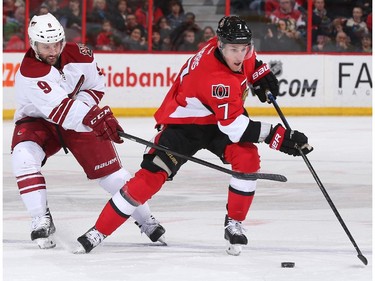 Kyle Turris #7 of the Ottawa Senators skates up ice with the puck against Sam Gagner #9 of the Arizona Coyotes at Canadian Tire Centre on January 31, 2015 in Ottawa, Ontario, Canada.
