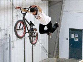 BMX rider Emile Otis does a "superman" on a new section of the 50,000-plus-square-foot indoor BMX bike park is under construction in Nepean.