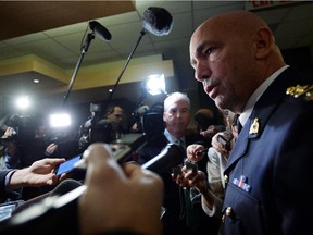 RCMP Commissioner Bob Paulson speaks to media after appearing at Senate National Security and Defence committee in October, 2014.