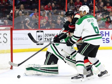 Bobby Ryan of the Ottawa Senators can't score on Kari Lehtonen as he is defended by Trevor Daley of the Dallas Stars during first period NHL action.