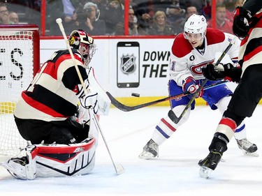 Brendan Gallagher, centre, looks to tip the puck past Craig Anderson with Cody Ceci (R) defending in the second period.