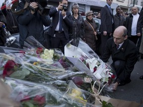 Canada's Minister of Public Safety Steven Blaney lays a wreath after an attack on a kosher market in which four hostages died in Paris, France, Saturday, Jan. 10, 2015.