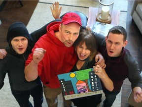 CHEO'S Dream Home winner, Lisa Austin-Wilton, couldn't believe the $1.7 million prize package when she brought her family (including husband Jesse Wilton and sons, James, 20, at left, and Josh, 24) to see the Manotick home for the first time Wednesday, January 7, 2015.
