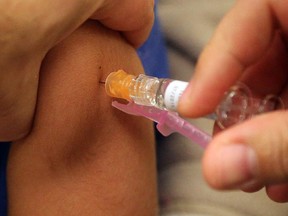 A child getting the flu vaccine.
