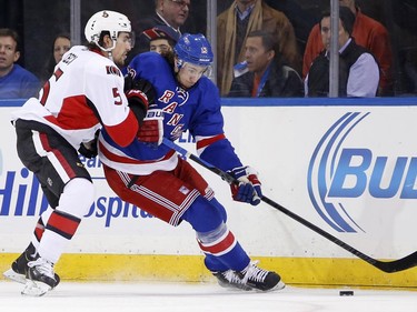 Ottawa Senators defenseman Cody Ceci (5) checks New York Rangers right wing Kevin Hayes (13) during the first period.