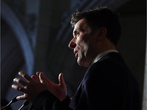 OntPaul Dewar NDP Foreign Affairs critic talks with reporters as he reacts to the Harper government's new anti-terror bill, on Parliament Hill, in Ottawa on Friday, January 30, 2015.