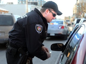 Constable Adrian Ring  pulls over a driver on Richmond Road.
