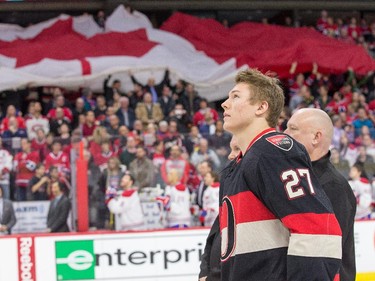 Curtis Lazar looks up after being introduced to the crowd as the captain of team Canada for the WJC prior to the first period.