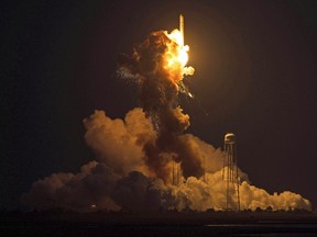 This image provided by NASA shows the Orbital Sciences Corporation Antares rocket, with the Cygnus spacecraft onboard, as it suffers a catastrophic anomaly moments after launch from the Mid-Atlantic Regional Spaceport Pad 0A, Tuesday, Oct. 28, 2014, at NASA's Wallops Flight Facility in Virginia. The Cygnus spacecraft was filled with about 5,000 pounds of supplies slated for the International Space Station, including science experiments, experiment hardware, spare parts, and crew provisions.